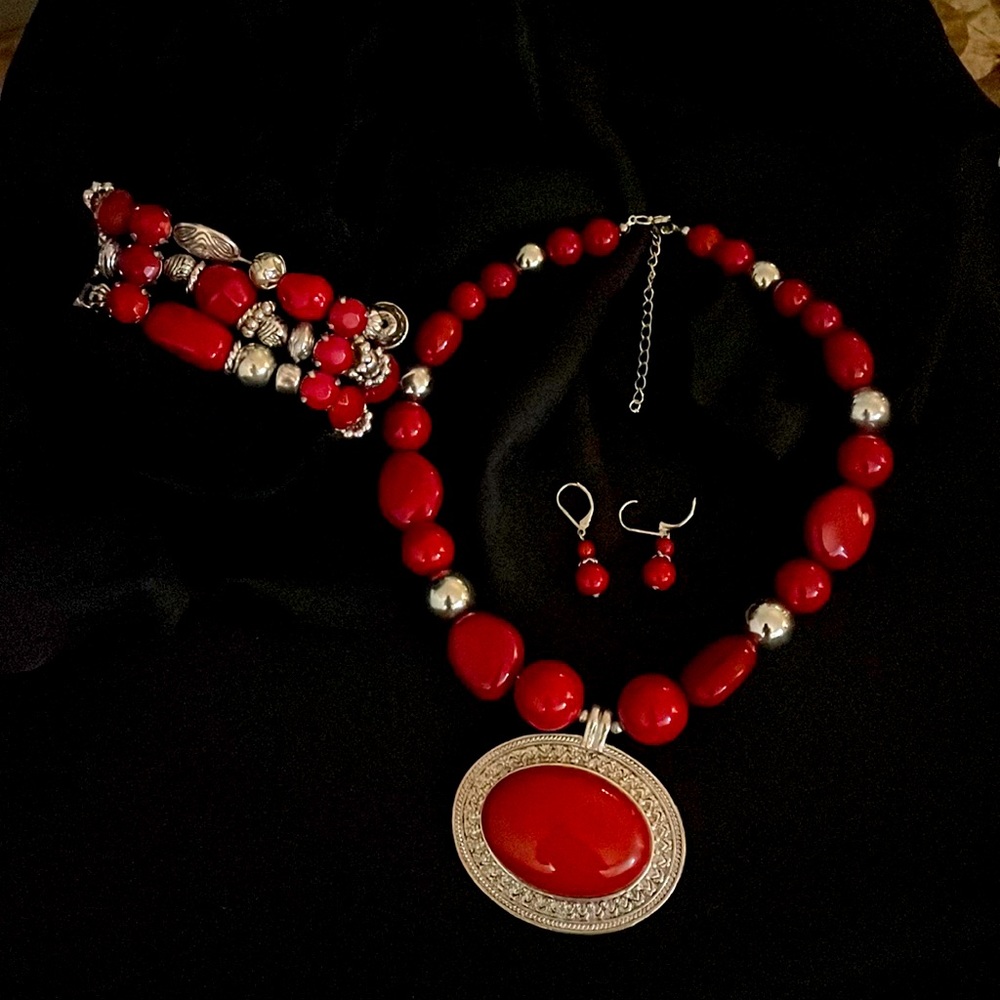 3-piece necklace, bracelet, and earrings set. Silver and red stones.